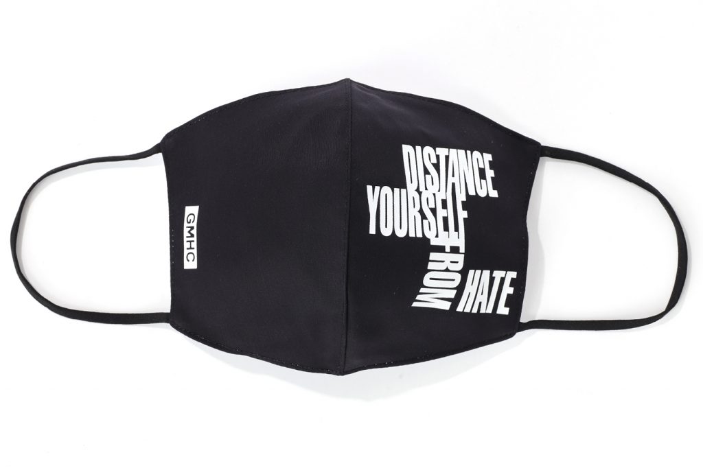News 44 GMHC mask that says "distance yourself from hate"