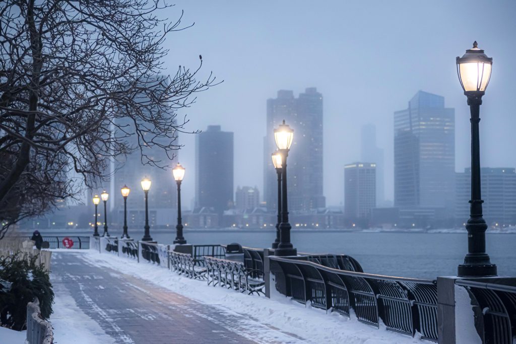 News 94 Photograph of street lamps along the Hudson River in New York City during the winter.