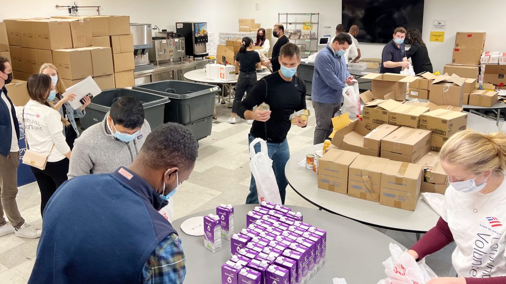 News 66 GMHC staff and volunteers packing food bags for clients